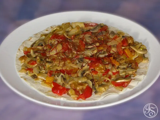 Champignongemüse auf Teigfladen